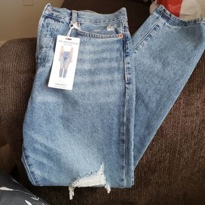 Distressed denim jeans.